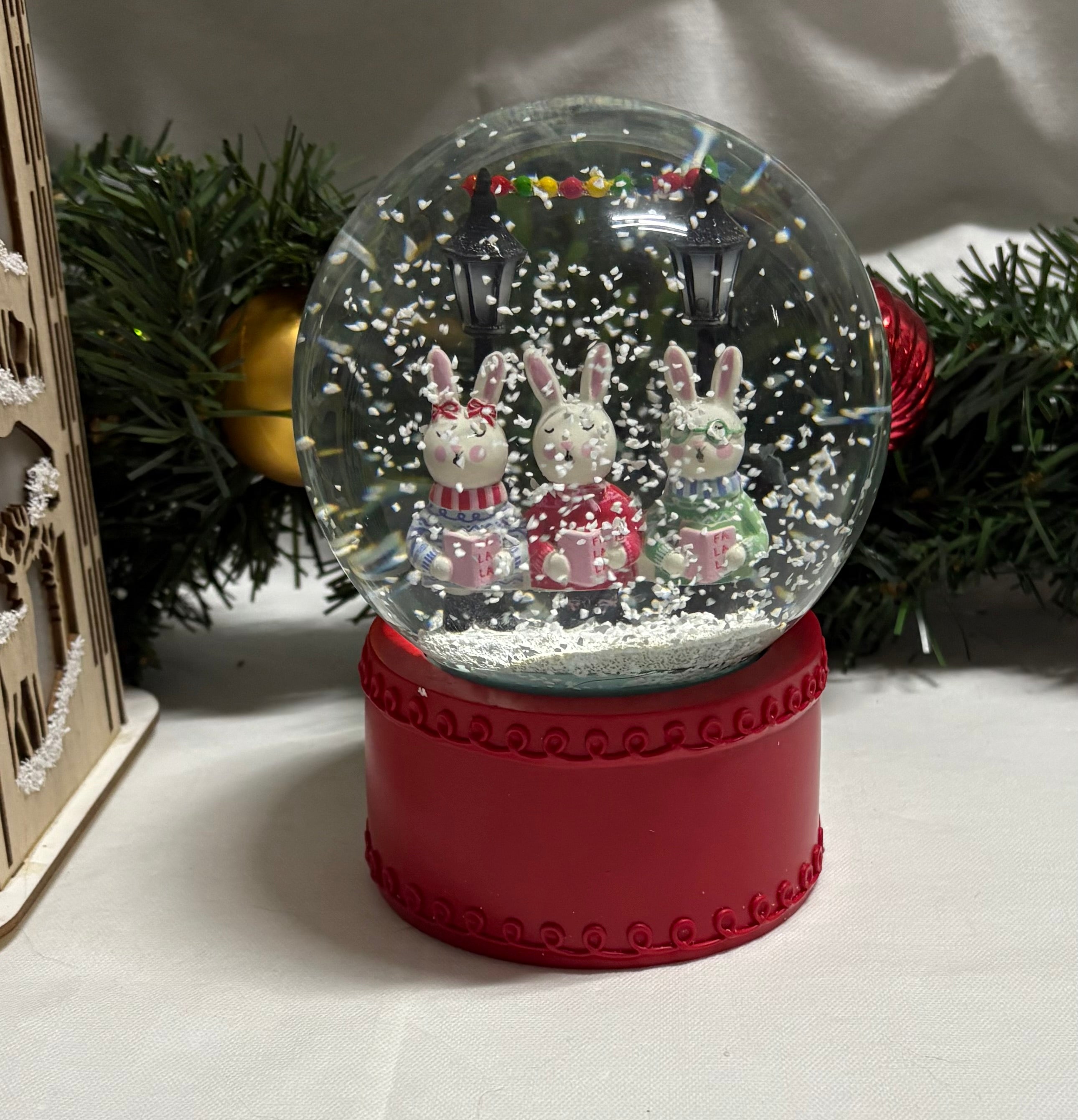 Beautiful Medium Sized Rabbits Snow Globe with Red Base