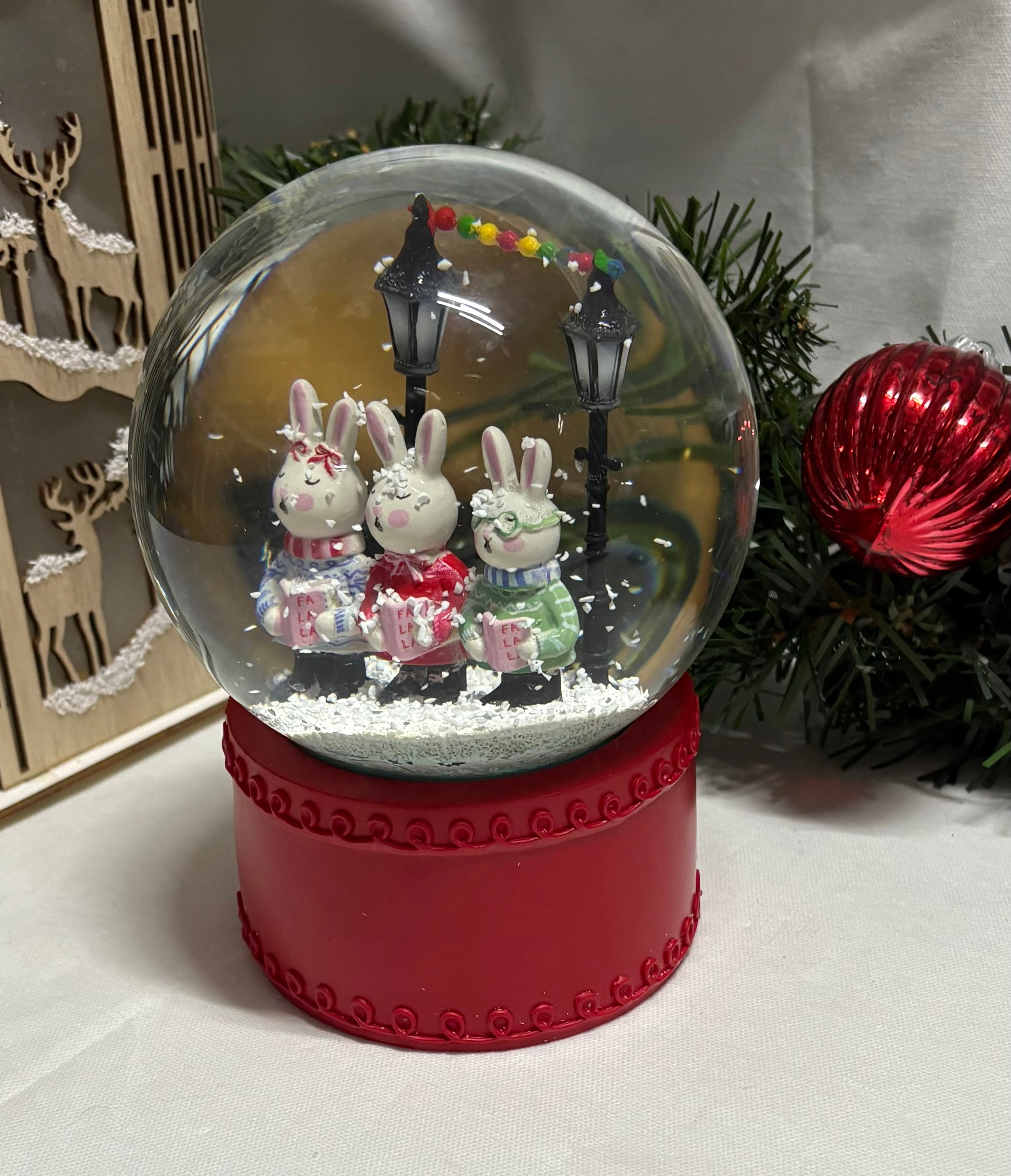Beautiful Medium Sized Rabbits Snow Globe with Red Base