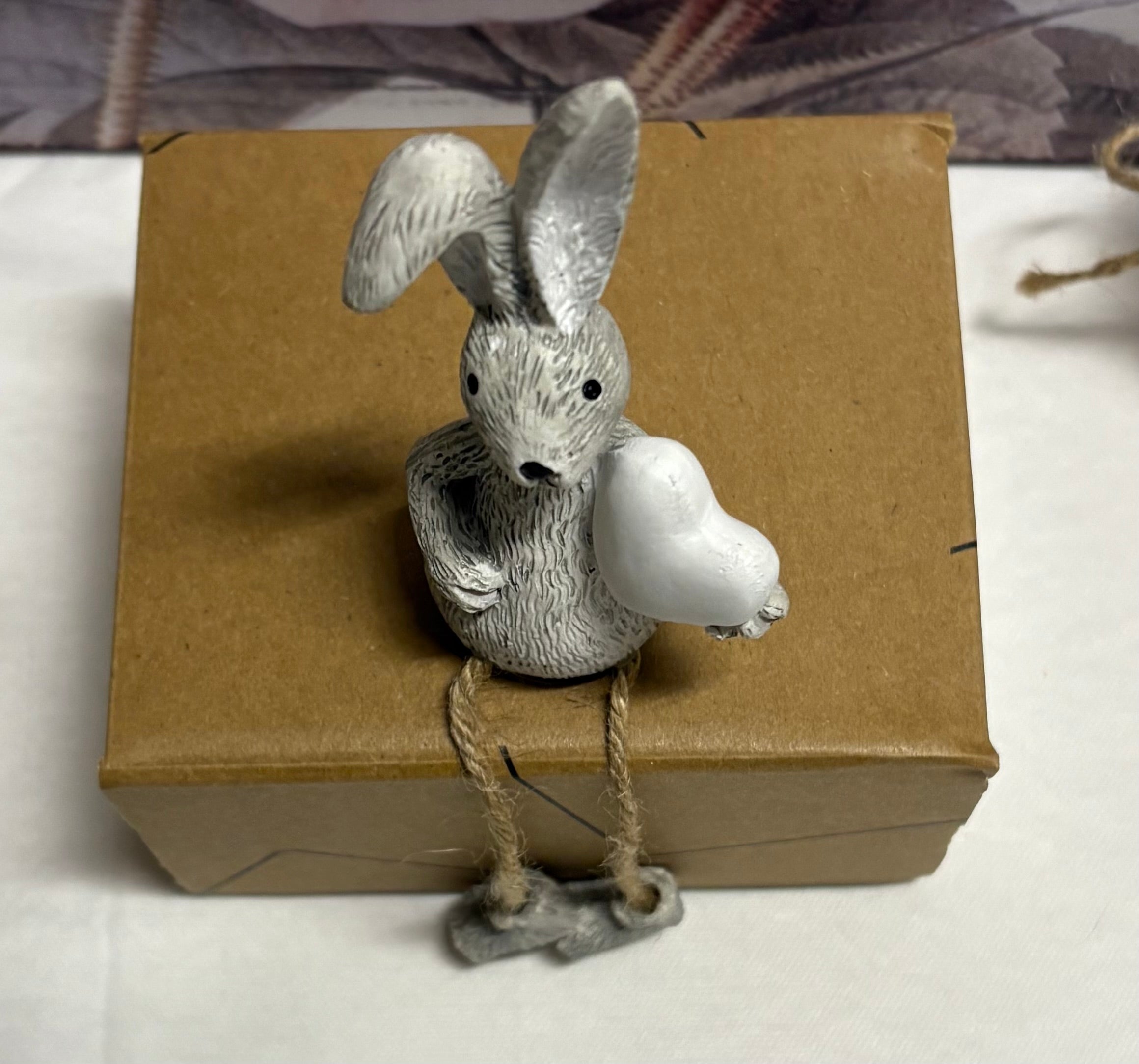 Grey Sitting White Heart Twine Leg Bunny Resin Figure