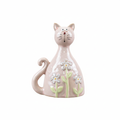Pink ceramic cat figurine with floral details and background removed
