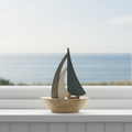 Wooden Sailboat on Coastal Windowsill